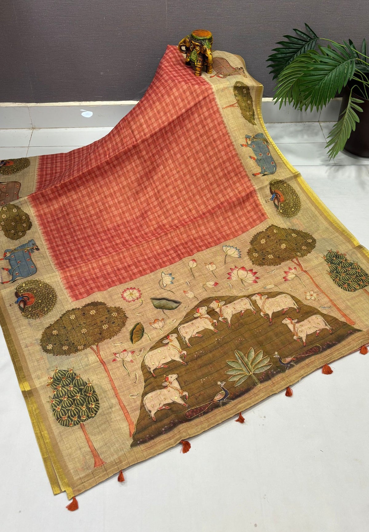 Tissue Linen Saree-Orange in Pichwai Cow & Peacock Motif Border
