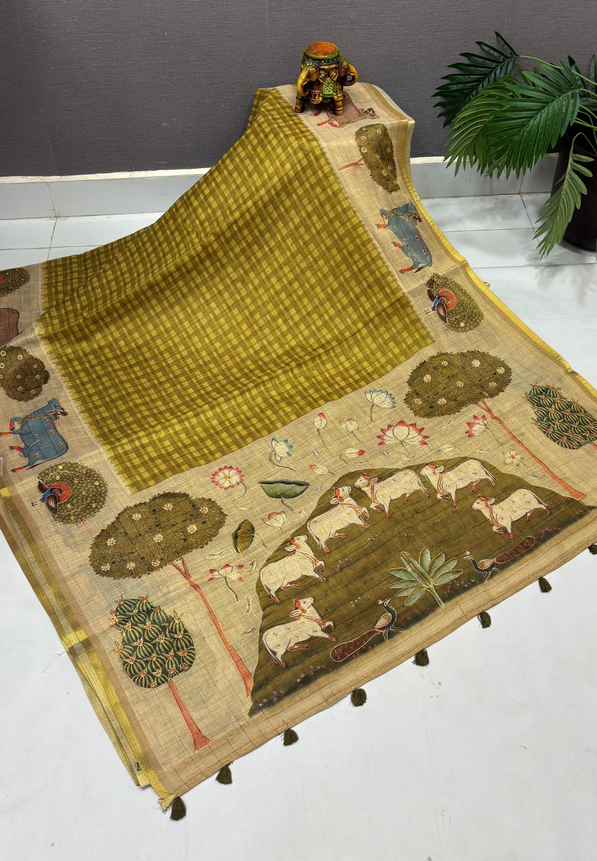 Tissue Linen Saree-Olive Green in Pichwai Cow & Peacock Motif Border